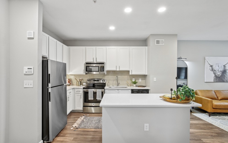 a kitchen with white cabinets